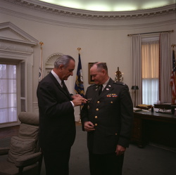 Pres. Lyndon B. Johnson promotes Col. Jack A. Albright to Brigadier General